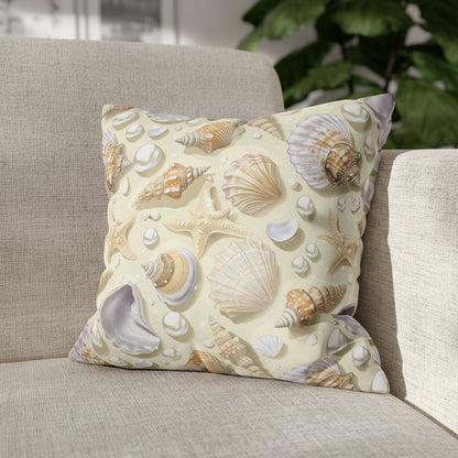 Decorative pillow with shell pattern on a couch.