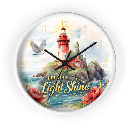 Decorative clock with a lighthouse design and 'Let Our Light Shine' text on a white background.