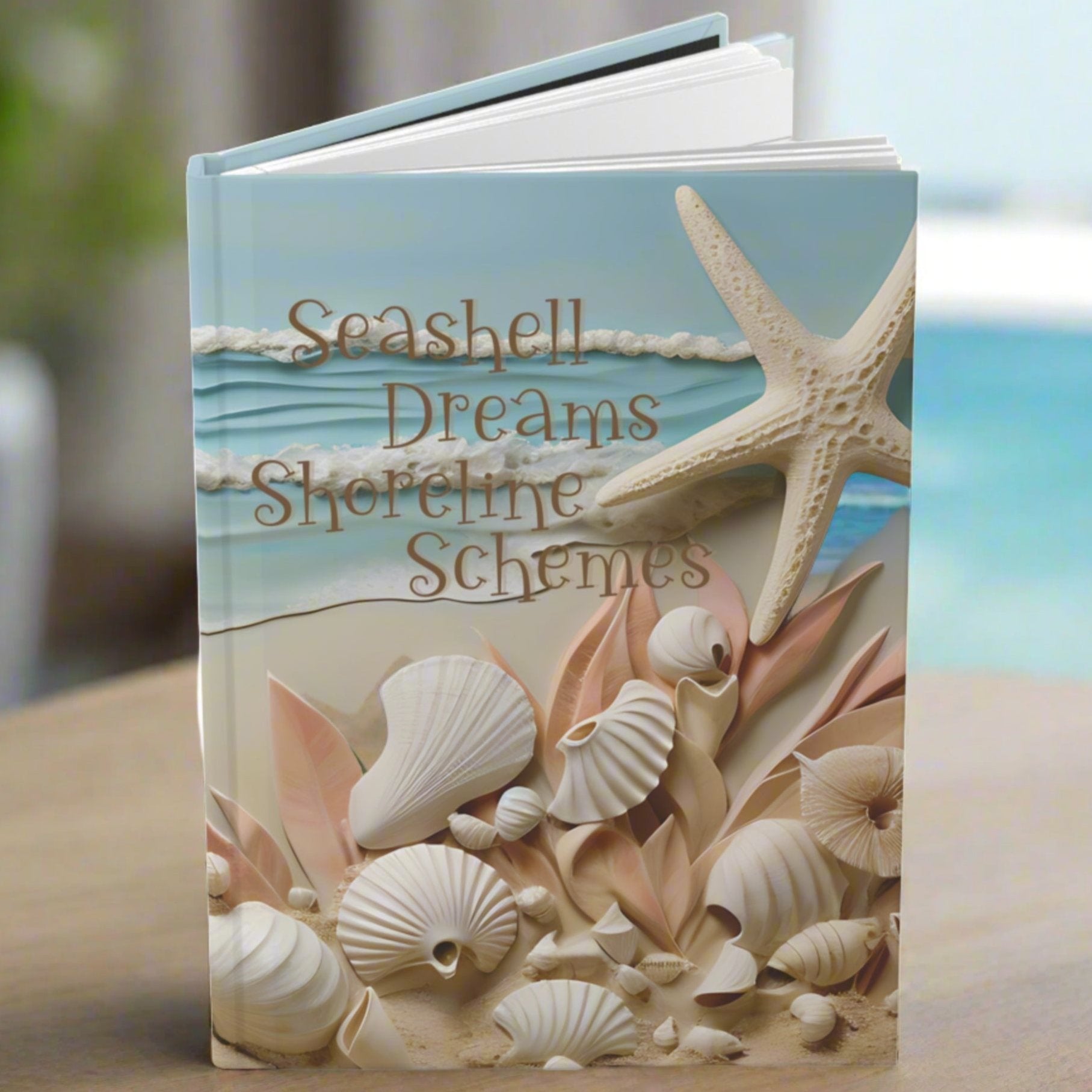 Hardcover journal with ocean waves, seashells, star fish and the text seashell dreams shoreline schemes