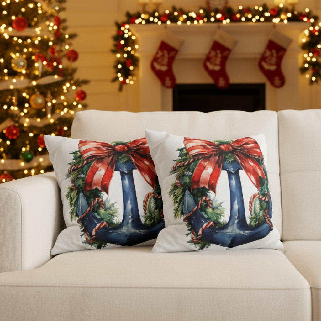 Decorative pillows with Christmas-themed designs on a sofa.