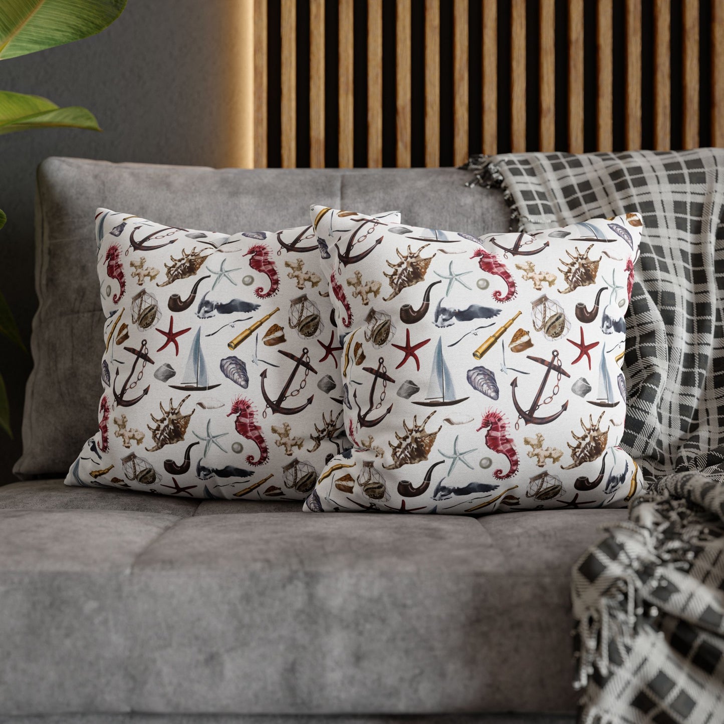 Two 16" x 16" white pillowcases featuring detailed graphics of anchors, seashells, sailboats, and seahorses in a nautical-themed pattern.