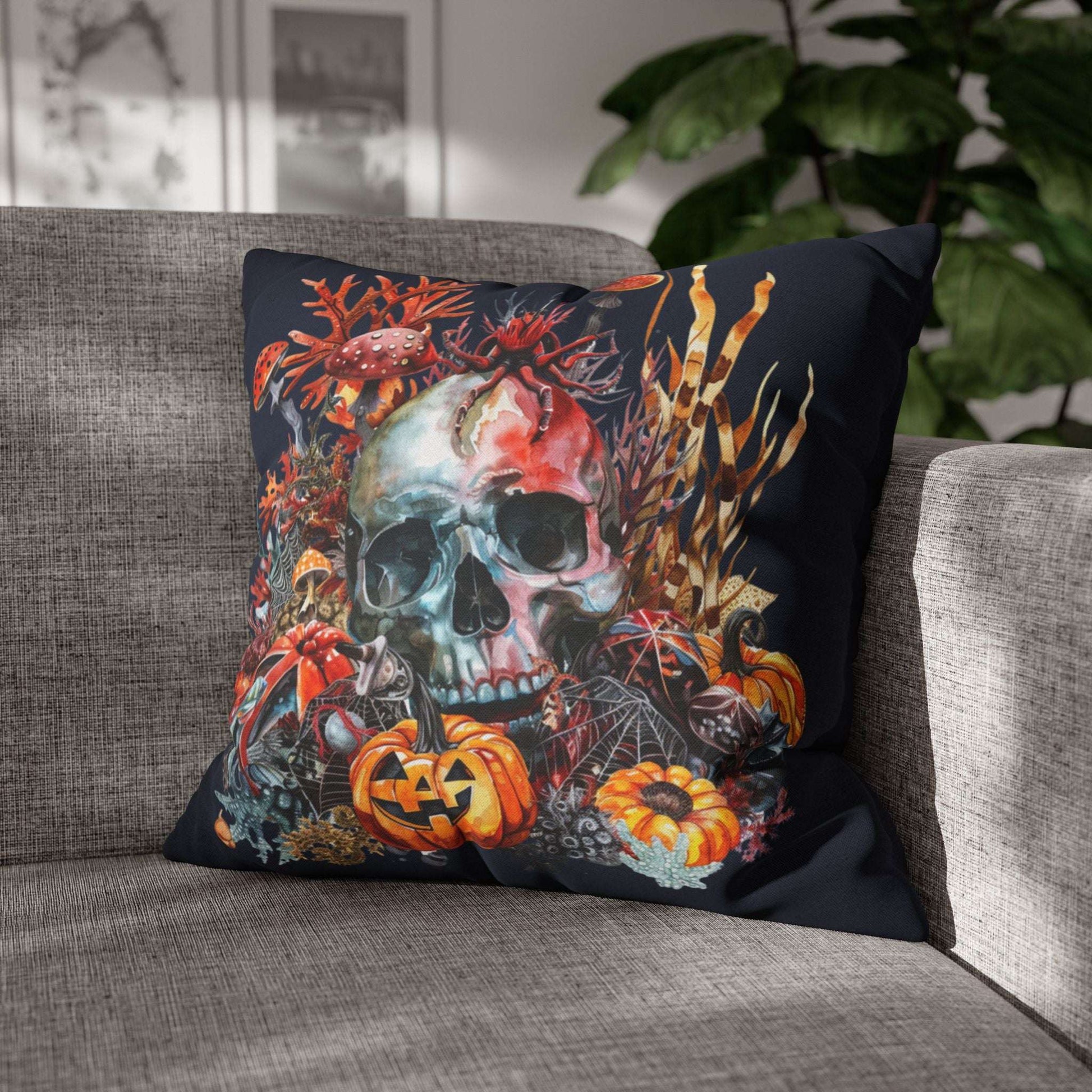 Decorative pillow cases with a skull and pumpkins design on a dark background.