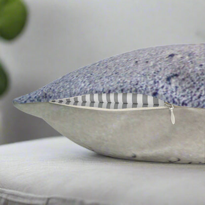 Decorative pillow with 'Chill at the Beach' text on a beach background showing the zipper closure.