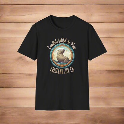 Black t-shirt with a graphic of a seal and text 'Coastal Wild & Free Crescent City, CA' on a white background