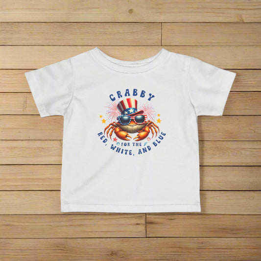 White Infant t-shirt with a crab wearing an American flag top hat surrounded by fireworks and seashells with the phrase “Crabby for the Red, White, and Blue.”