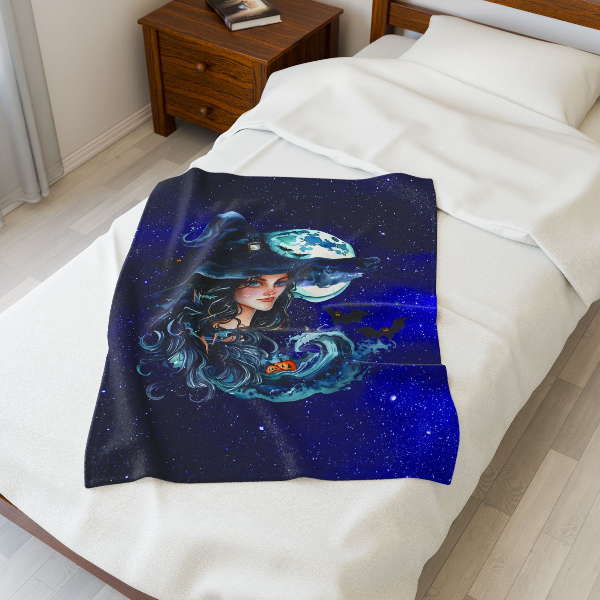 Halloween plush 30" x 40" blanket with witch, ocean wave, pumpkins, and full moon in starry sky.