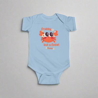 Light Blue short-sleeved bodysuit with cartoon crab that says crabby but a cutie with a space for a personalized name below.