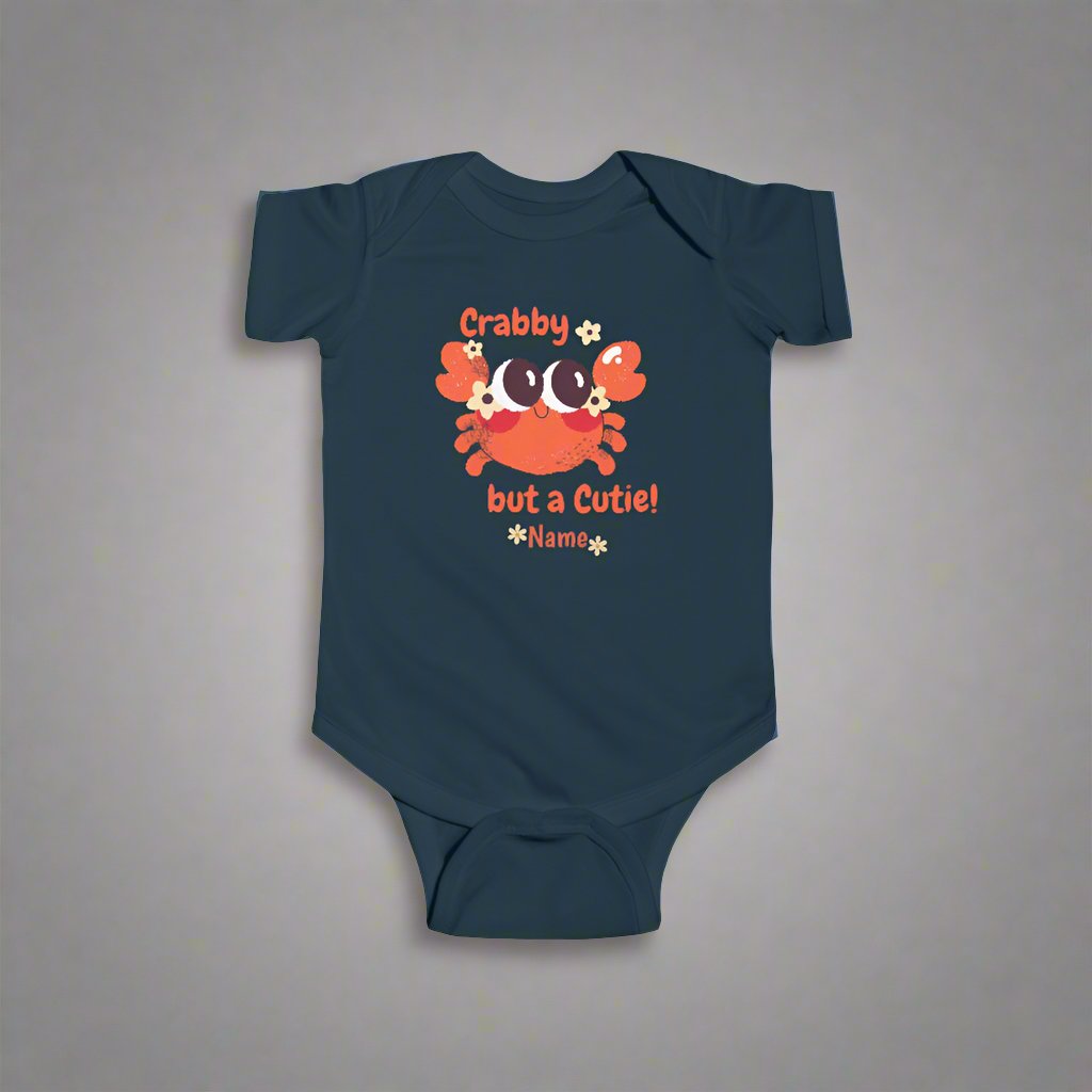 Navy Blue short-sleeved bodysuit with cartoon crab that says crabby but a cutie with a space for a personalized name below.