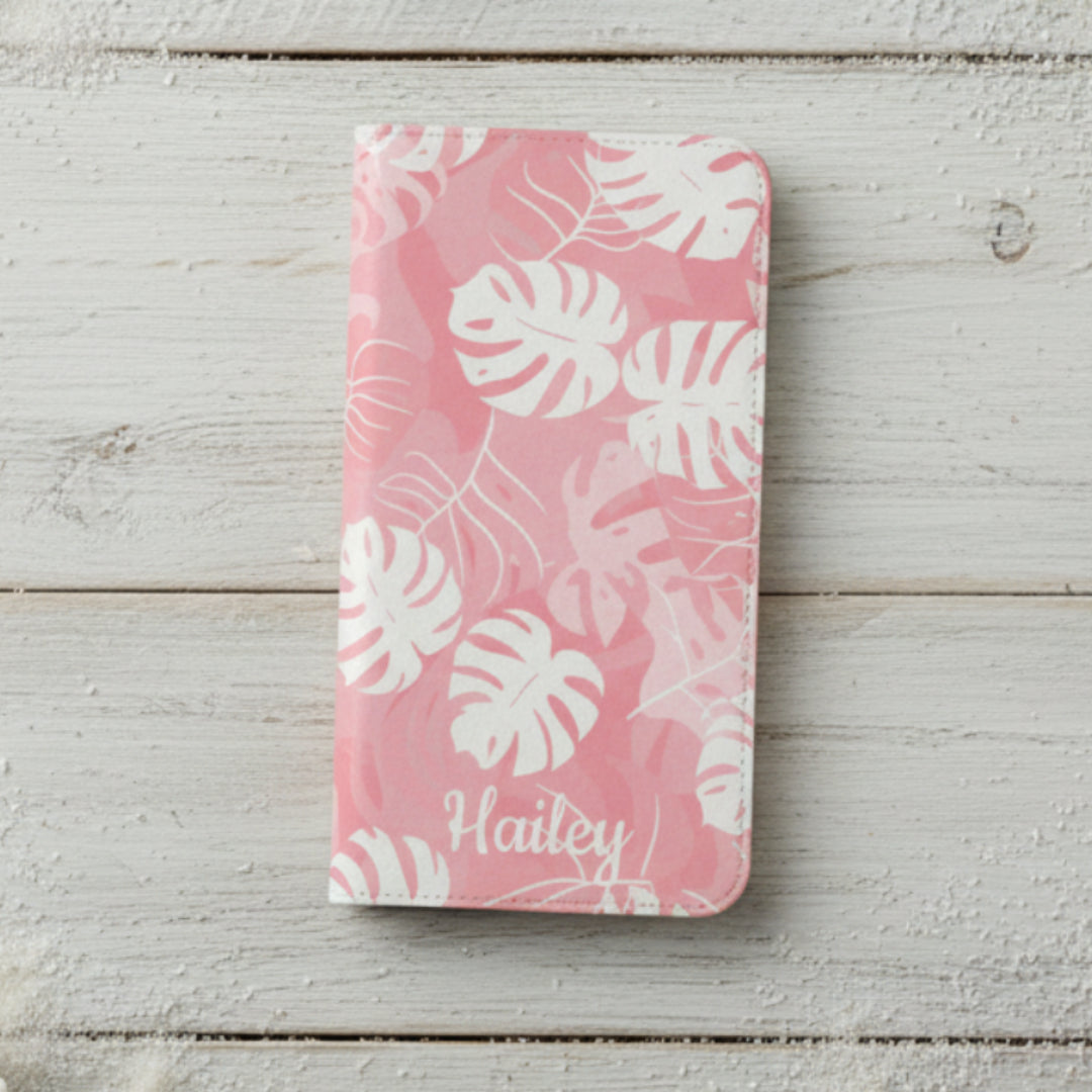 Pink phone case with white leaf pattern.