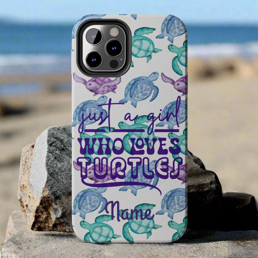 Phone case with sea turtle design and text 'Just a girl who loves turtles' on a gray background
