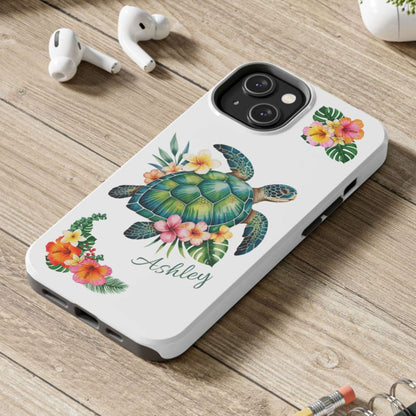 iPhone 14 case with a white background and a sea turtle with hibiscus flowers, with more hibiscus flowers around the sides.