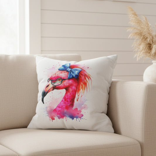 Decorative square pillowcase featuring a flamingo head wearing glasses and a big blue bow on a white background.