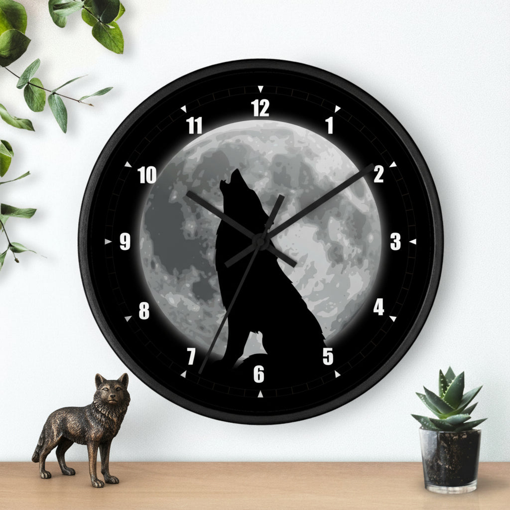 Wall clock with a wolf howling at the moon design on a white wall.