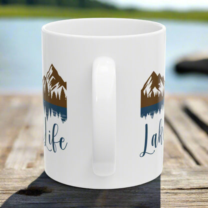 Handle side view of our white 11 oz. ceramic mug with mountain and lake reflection design, featuring the phrase “Lake Life” – perfect for nature lovers.
