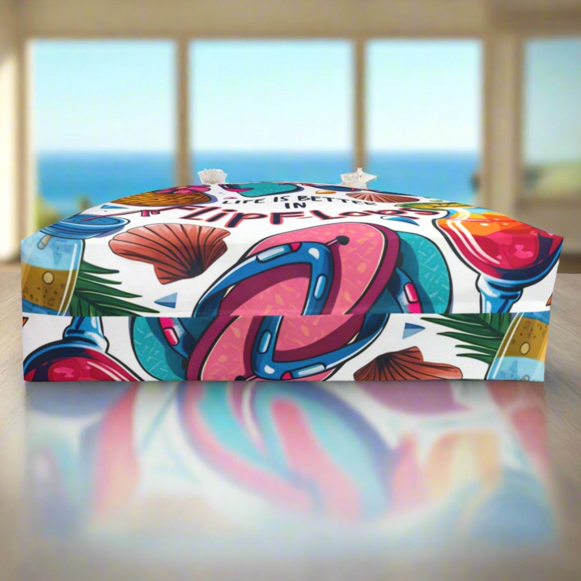 The bottom of a weekender tote that shows the pattern with flip flops, seashells and cocktails on a white background