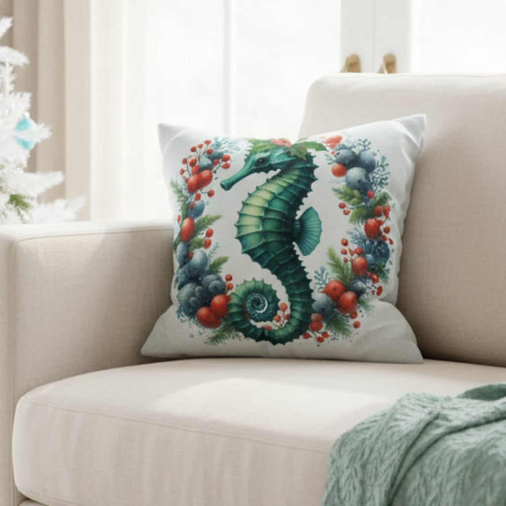Decorative pillow with a seahorse design on a gray couch
