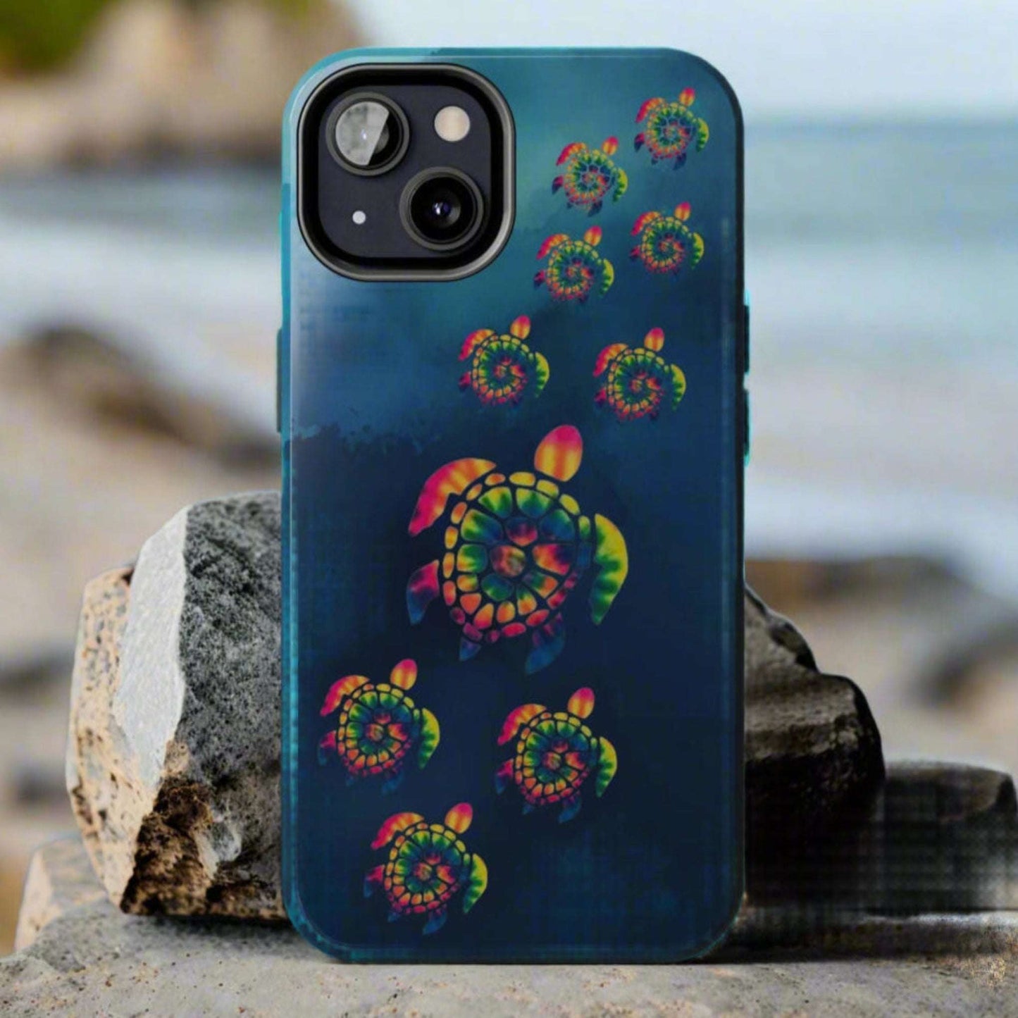 Phone case with colorful turtle design on a blue background