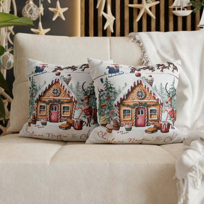 Decorative pillows with gingerbread house design on a sofa.