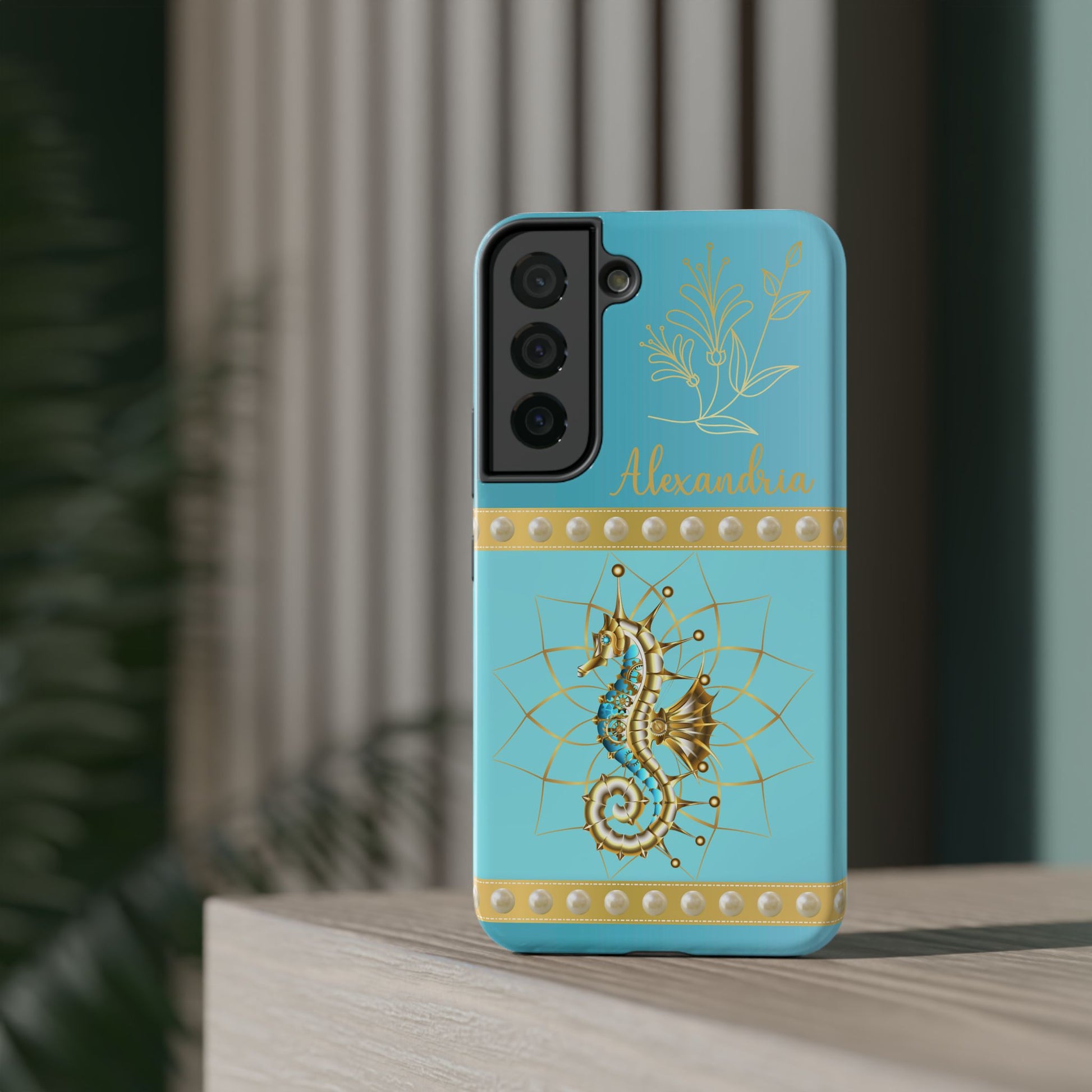 Phone case with seahorse design and 'personalized' text on a teal blue background