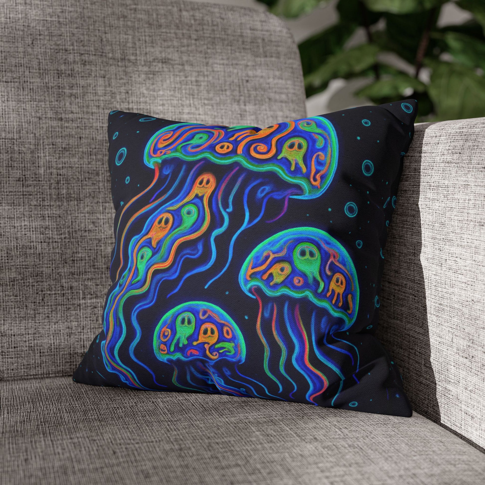 Colorful jellyfish design pillow on a gray couch