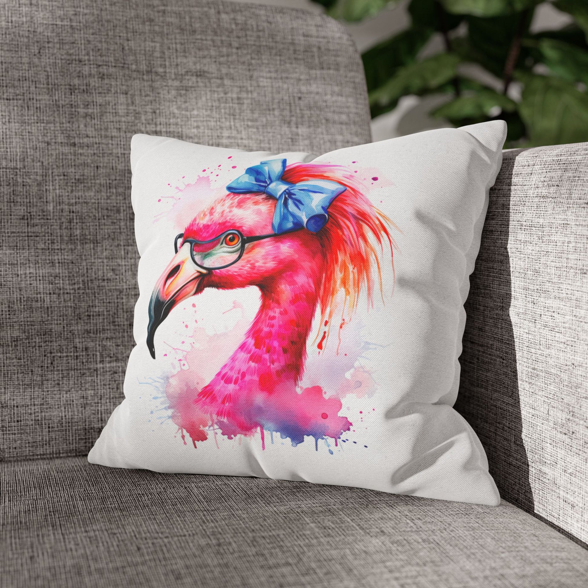 Decorative Square pillowcase featuring a flamingo head wearing glasses and a big blue bow on a white background.