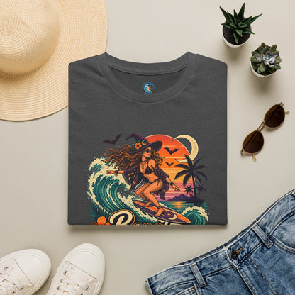 Folded Dark Gray Heather unisex t-shirt with “Beach Witch Energy” text, a witchy surfer girl, ocean wave, sunset, crescent moon, bats, palm trees, and tropical flowers.