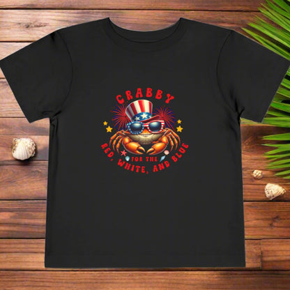 Black t-shirt with a colorful graphic of a crab wearing an American flag hat and sunglasses, with text 'CRABBY FOR THE RED, WHITE, AND BLUE' on a white background.
