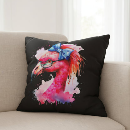 Decorative pillow with a colorful flamingo design on a beige couch.