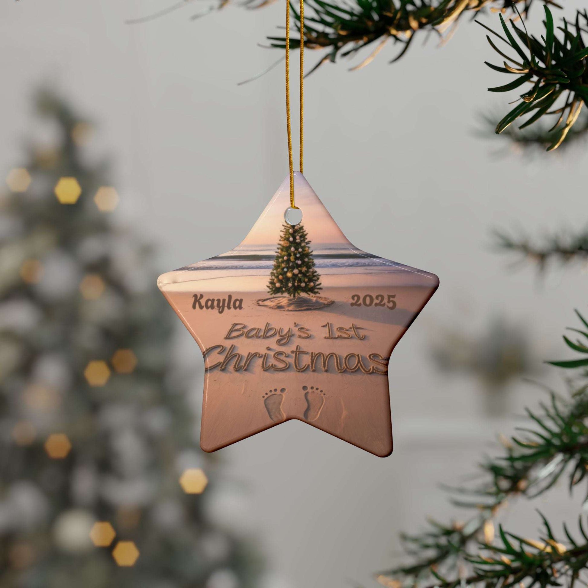 Star-shaped Christmas ornament with 'Baby's 1st Christmas' engraving hanging on a tree.