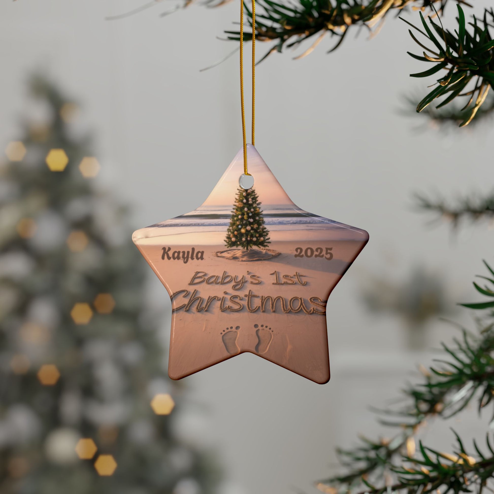Star-shaped Christmas ornament with 'Baby's 1st Christmas' engraving hanging on a tree.