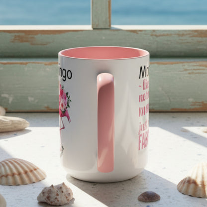 White mug with pink interior and handle, featuring text and a floral design on a white background.