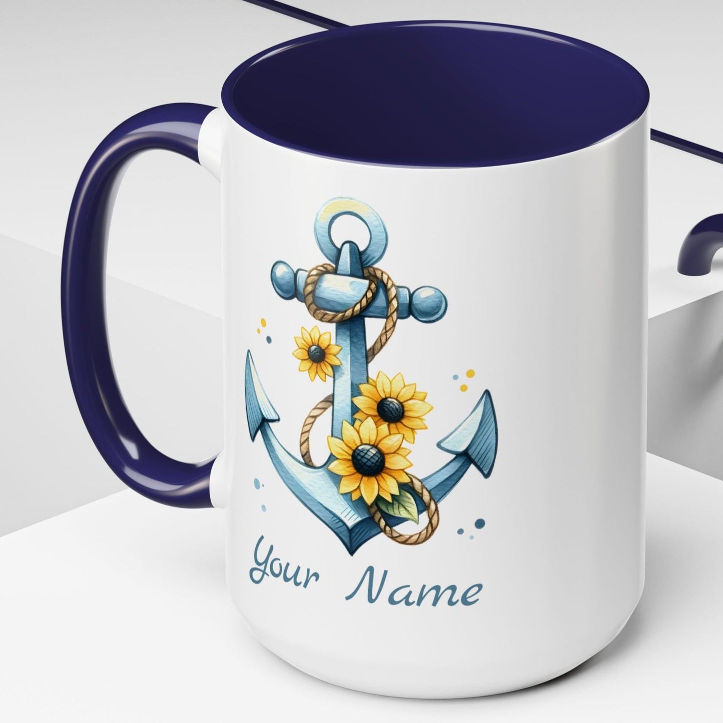 15 oz. White mug with blue handle and interior with Anchor and Sunflowers with text Seas the Day