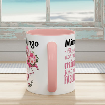 White mug with pink interior and handle, featuring text and a flamingo design on a white background.