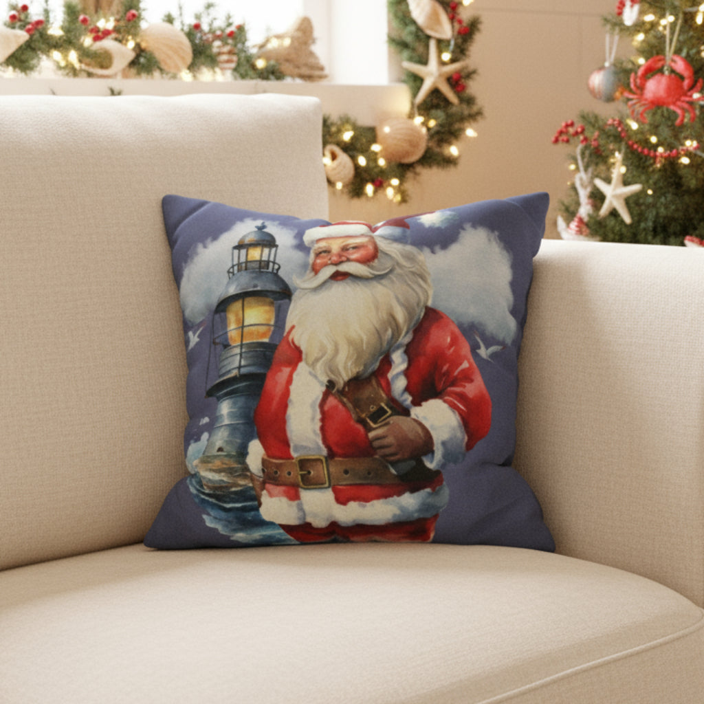 Decorative pillow with Santa Claus and lighthouse design on a couch.
