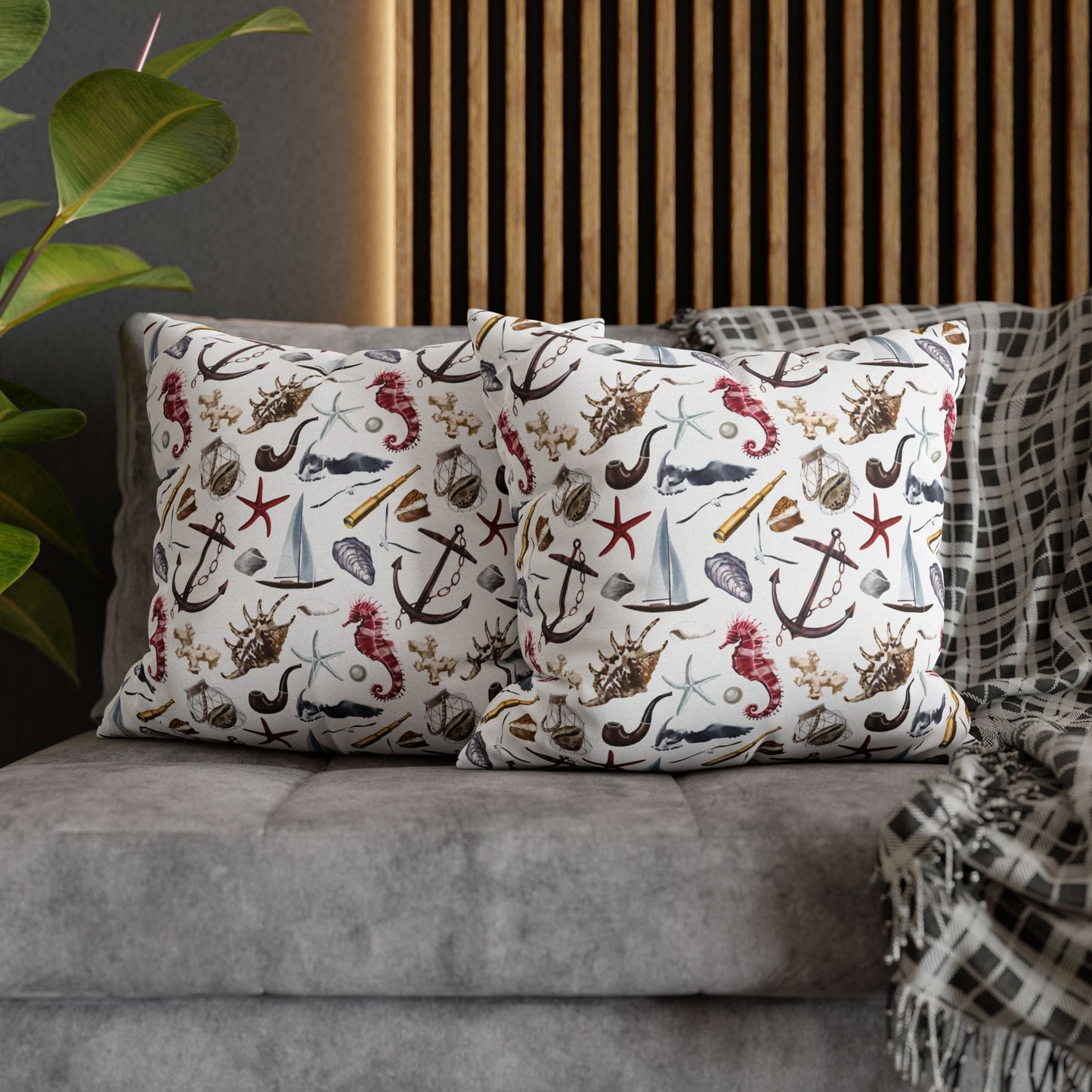 Two 20" x 20" white pillowcases featuring detailed graphics of anchors, seashells, sailboats, and seahorses in a nautical-themed pattern.