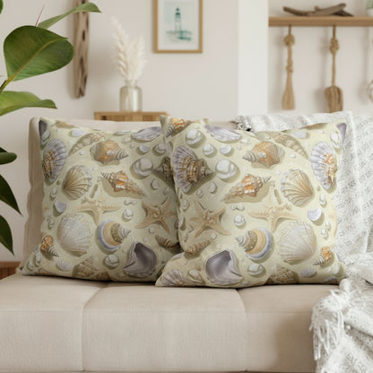 Decorative pillows with shell pattern on a gray sofa