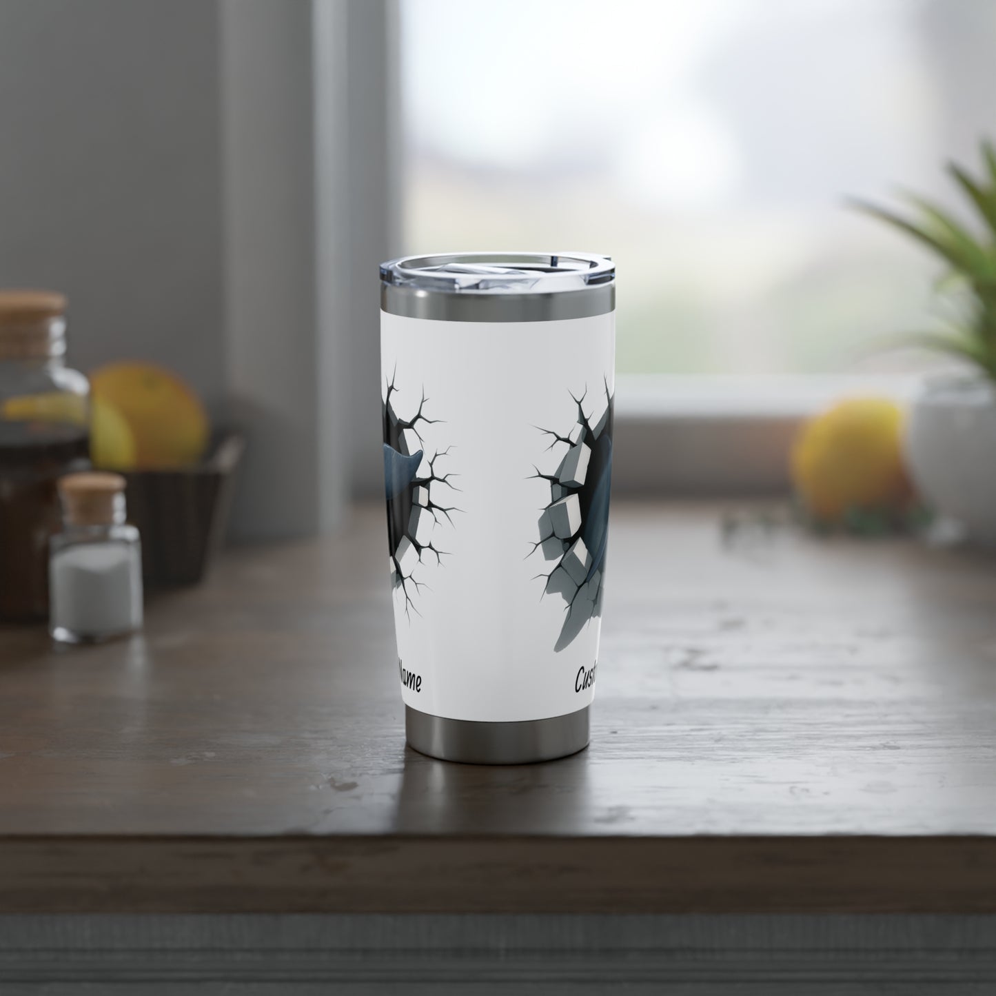 Side view of white tumbler with dolphin design on a white background.
