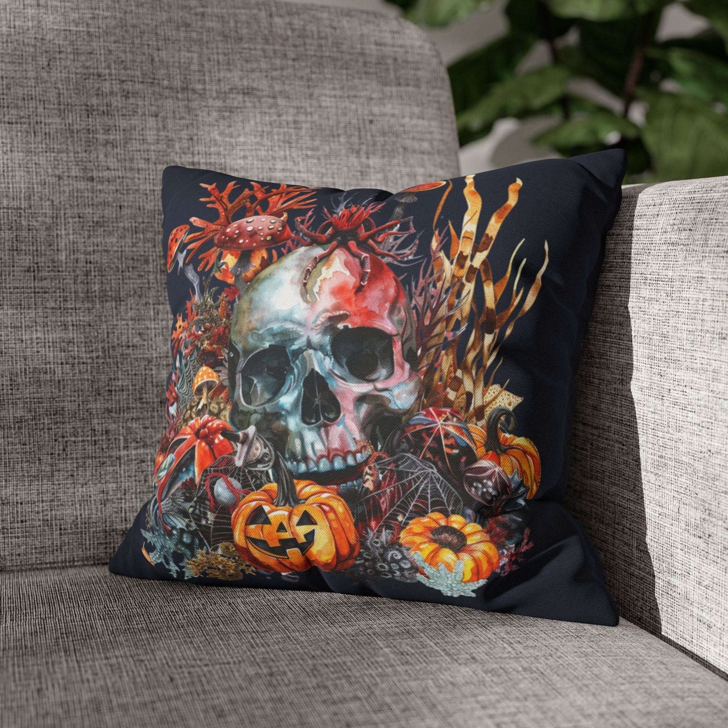 Decorative pillow cases with a skull and pumpkins design on a dark background.