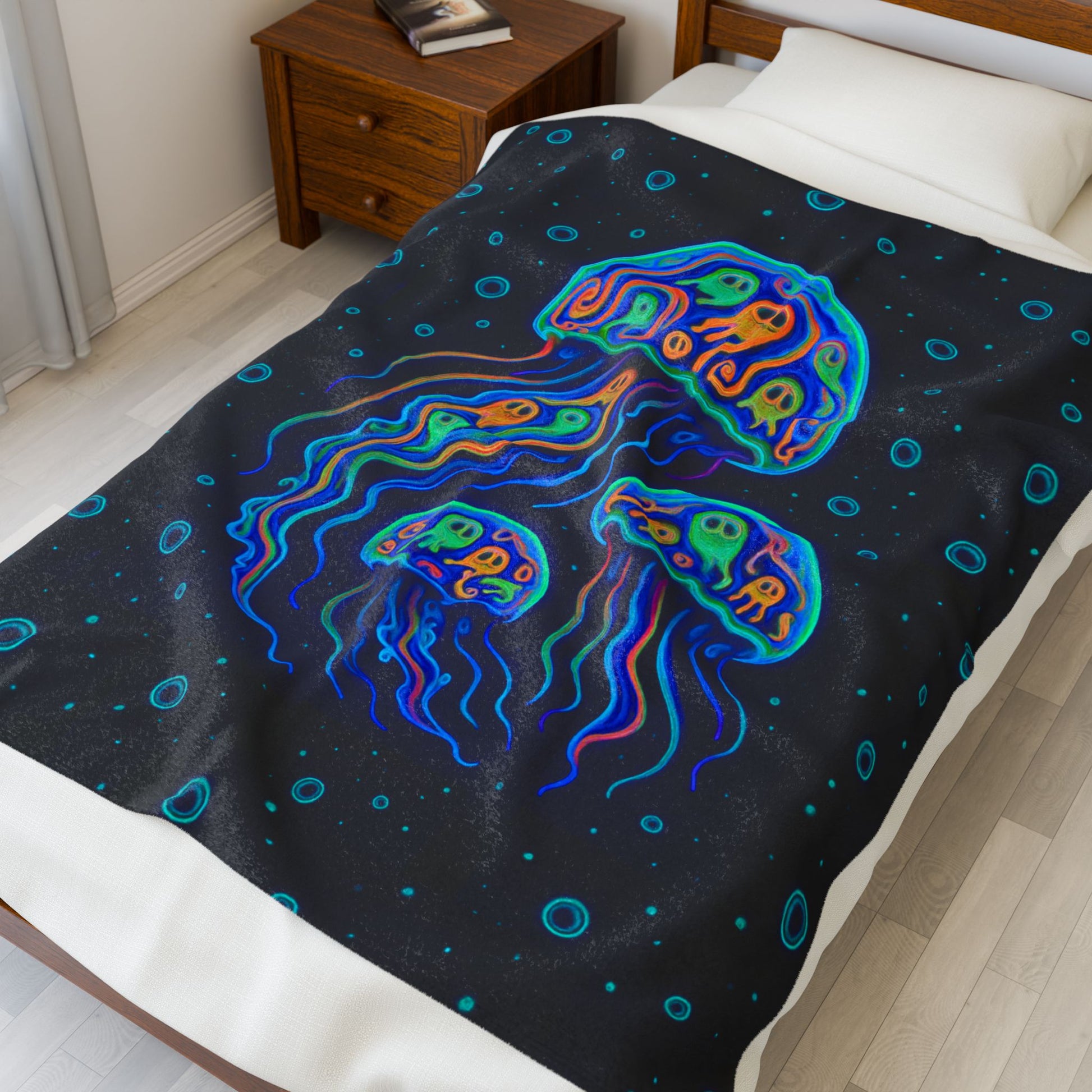 Pop art jellyfish 50" x 60" plush blanket with pumpkins inside and water bubbles on black background.