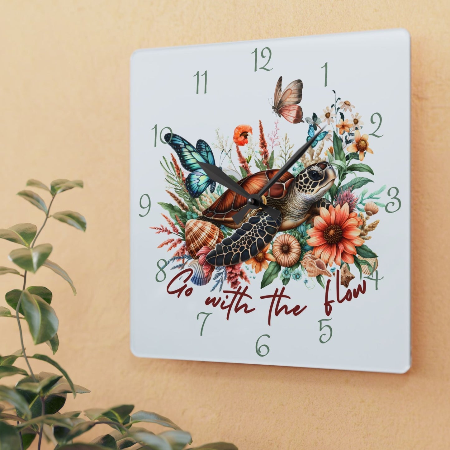 Decorative wall clock with sea turtle and floral design with text Go with the Flow.