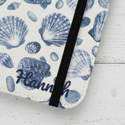 Flip phone case with blue shell pattern and option to be personalized.