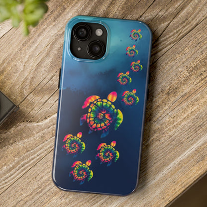 Phone case with colorful spiral design on a wooden surface next to a camera