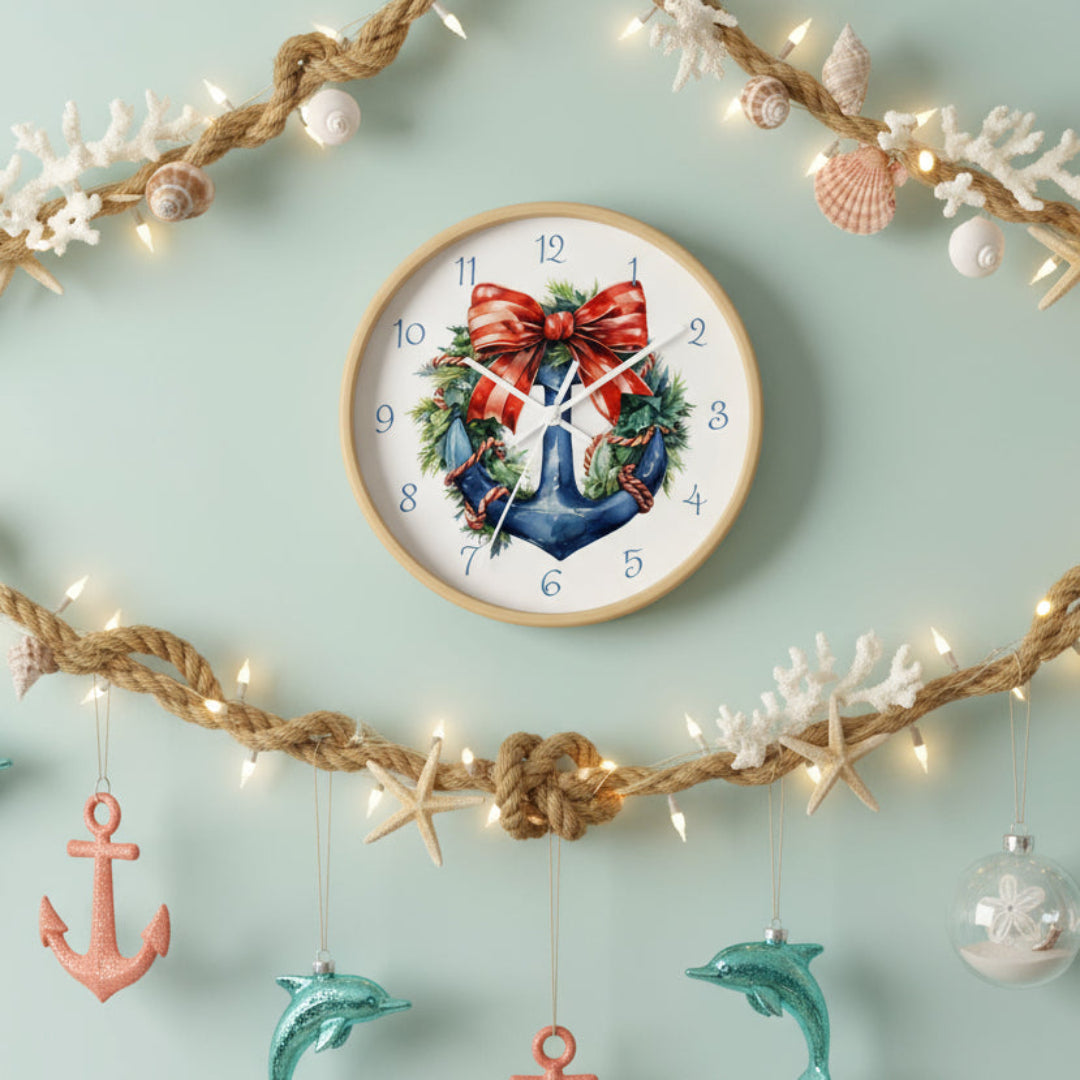Decorative clock with a blue anchor, red bow, and greenery on a white background