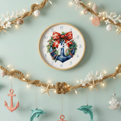 Decorative clock with a blue anchor, red bow, and greenery on a white background