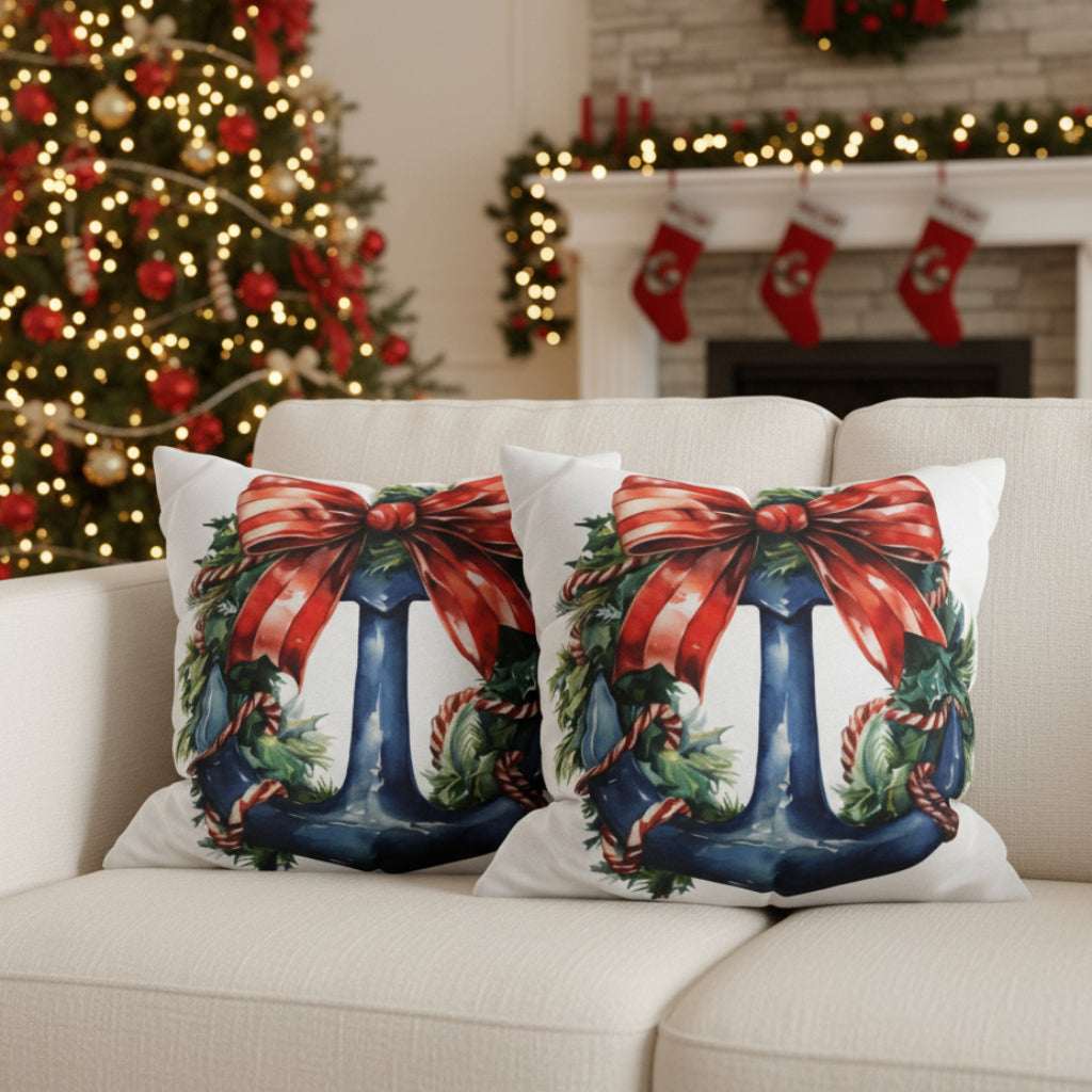 Decorative pillows with Christmas-themed designs on a sofa.