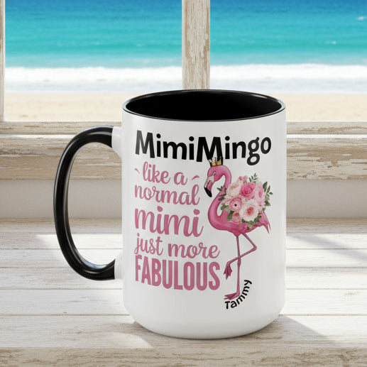 White mug with black interior and handle, featuring a flamingo graphic and text on a white background.