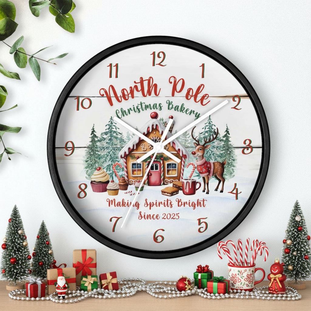 Decorative Christmas-themed clock with a gingerbread house and reindeer design on a white background.