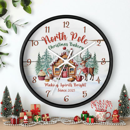 Decorative Christmas-themed clock with a gingerbread house and reindeer design on a white background.