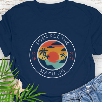 Navy blue t-shirt with circle design with a beach scene and the text “Born for the Beach Life.