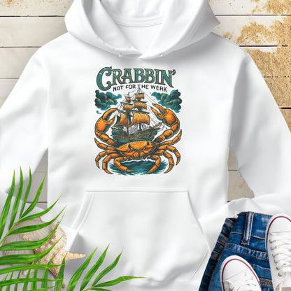 White hoodie with a large crab enveloping a pirate ship with the text “Crabbin’s Not for the Weak” in an old-style font.